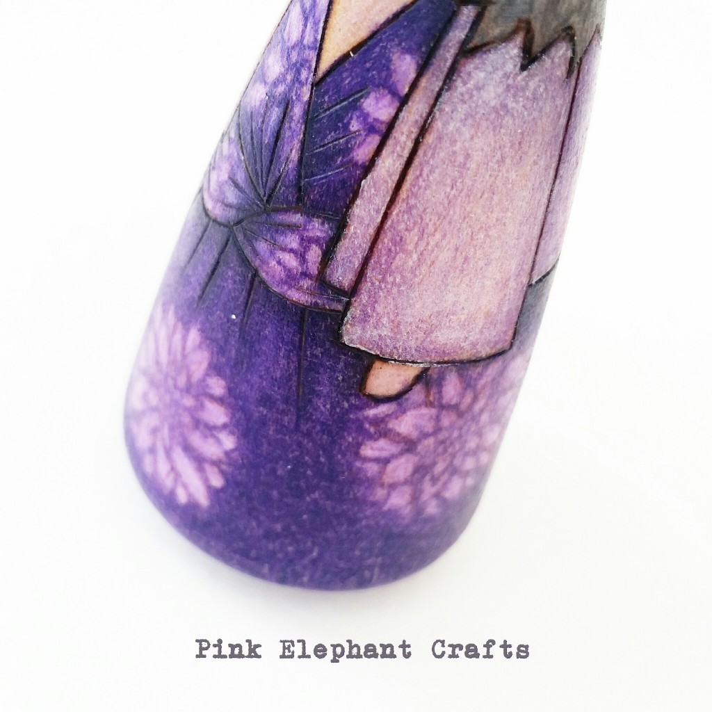 pretty peg doll detail of purple dress