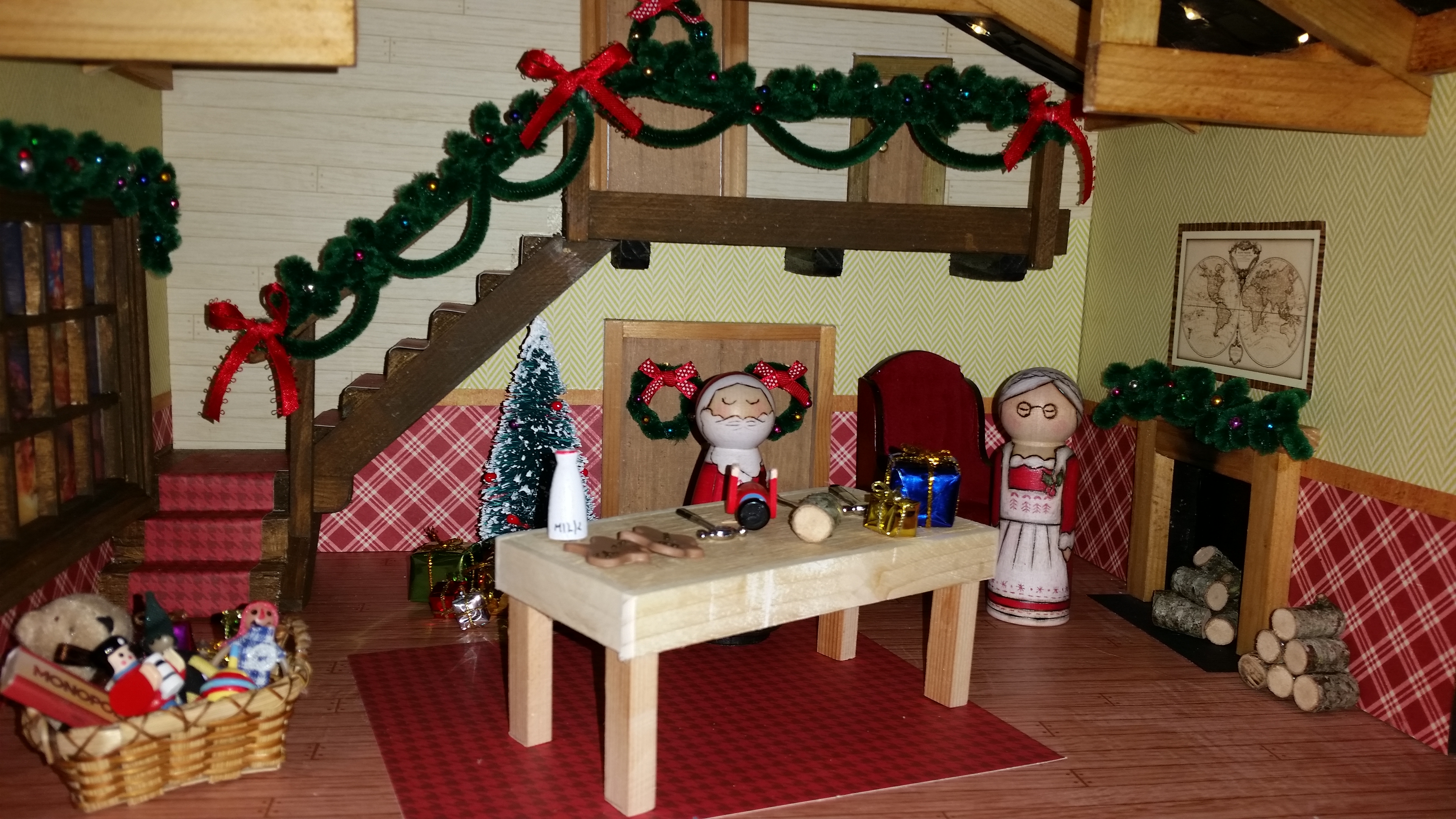 Santa and Mrs Claus Peg dolls in their North Pole Workshop
